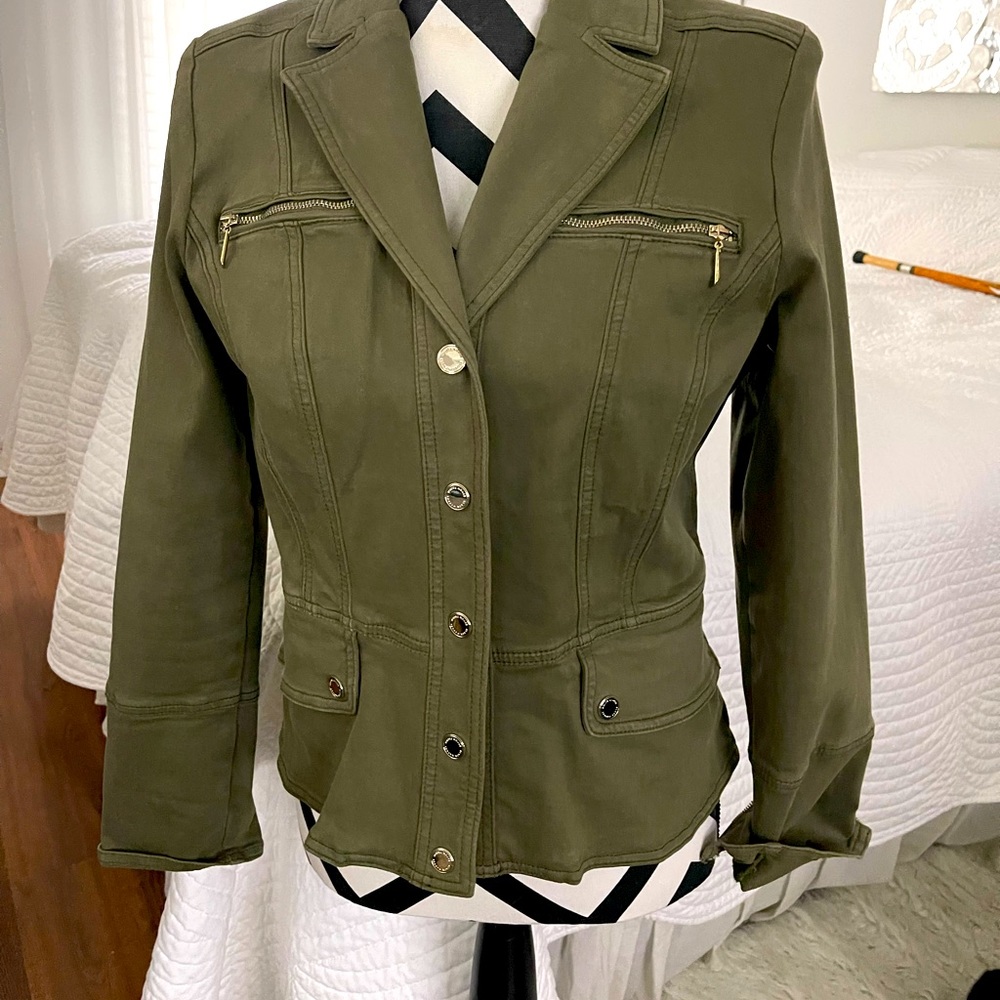 Kharki/Olive color peplum jacket with stud closures.